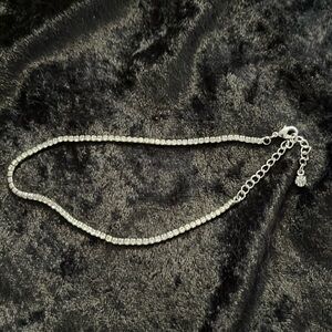 Ankle bracelet. Silver toned with rhinestones.